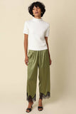 Quinn Satin Pants in Olive Black, styled full length