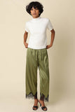 Quinn Satin Pants in Olive Black, styled front