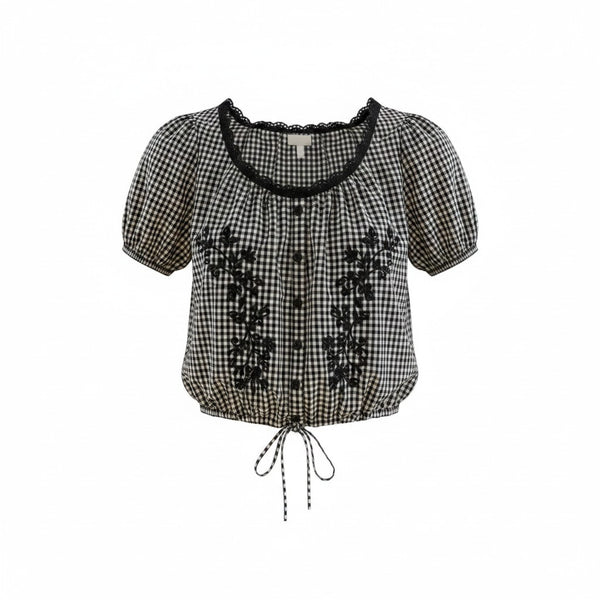 VIDA MOULIN black and white gingham blouse with floral embroidery, puff sleeves, scoop neckline, and drawstring hem.