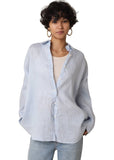 VIDA MOULIN light blue Jada linen shirt with oversized fit and drop shoulder, worn over a cream tank top.