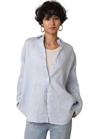 VIDA MOULIN light blue Jada linen shirt with oversized fit and drop shoulder, worn over a cream tank top.
