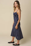VIDA MOULIN navy blue polka dot midi dress with sweetheart neckline and adjustable straps, made of linen blend.