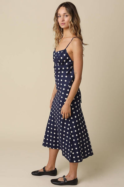 VIDA MOULIN navy blue polka dot midi dress with sweetheart neckline and adjustable straps, made of linen blend.