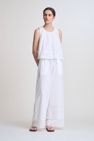 VIDA MOULIN white sleeveless 100% cotton eyelet swing top with round neck and back tie detail.