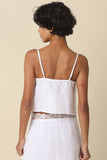 VIDA MOULIN white linen cami top with lace trim and adjustable spaghetti straps.