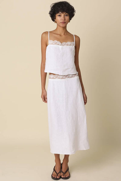 VIDA MOULIN white linen cami top with lace trim and adjustable spaghetti straps, paired with a matching skirt.